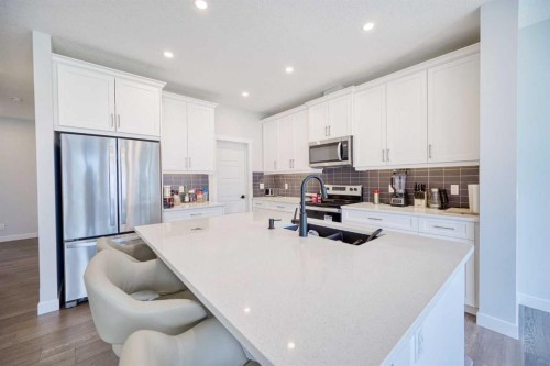 38 Setonstone Green Se, Calgary, AB - Indoor Photo Showing Kitchen With Stainless Steel Kitchen With Double Sink With Upgraded Kitchen