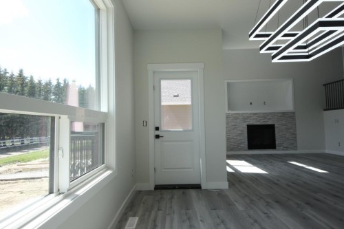 35 Viceroy Crescent, Olds, AB - Indoor Photo Showing Other Room With Fireplace