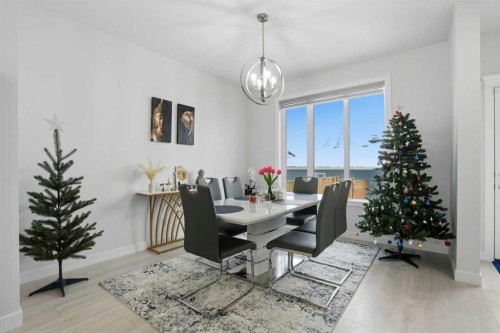 496 Reynolds Avenue Sw, Airdrie, AB - Indoor Photo Showing Dining Room