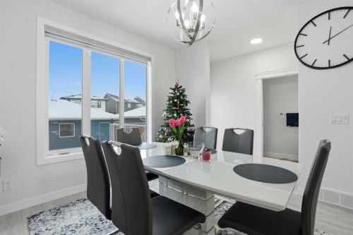 496 Reynolds Avenue Sw, Airdrie, AB - Indoor Photo Showing Dining Room