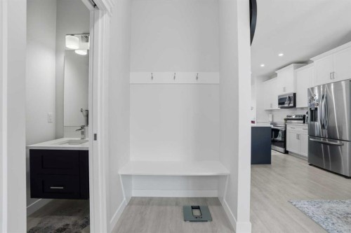 496 Reynolds Avenue Sw, Airdrie, AB - Indoor Photo Showing Kitchen