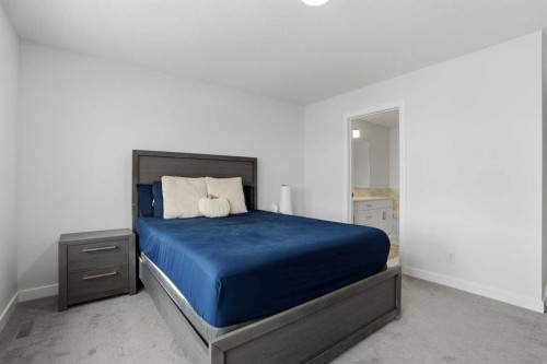 496 Reynolds Avenue Sw, Airdrie, AB - Indoor Photo Showing Bedroom