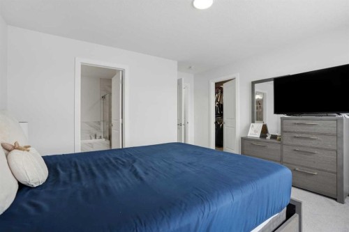496 Reynolds Avenue Sw, Airdrie, AB - Indoor Photo Showing Bedroom