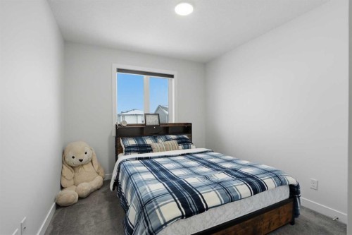 496 Reynolds Avenue Sw, Airdrie, AB - Indoor Photo Showing Bedroom