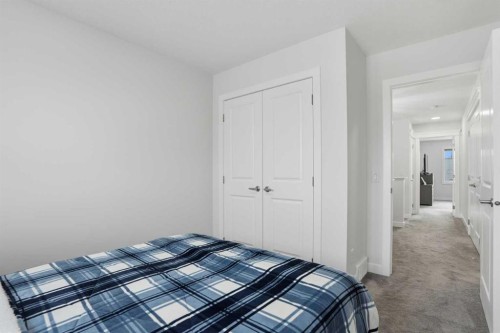 496 Reynolds Avenue Sw, Airdrie, AB - Indoor Photo Showing Bedroom