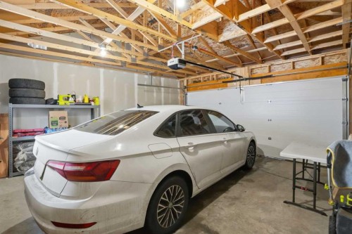 496 Reynolds Avenue Sw, Airdrie, AB - Indoor Photo Showing Garage