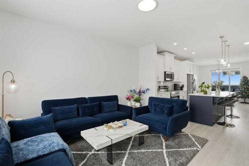 496 Reynolds Avenue Sw, Airdrie, AB - Indoor Photo Showing Living Room