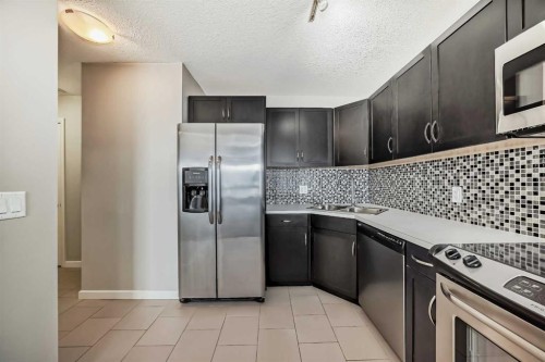 1601-1320 1 Street Se, Calgary, AB - Indoor Photo Showing Kitchen With Stainless Steel Kitchen With Double Sink With Upgraded Kitchen