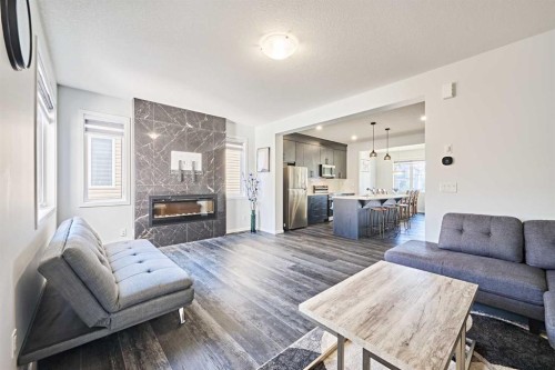 155 Carringham Road Nw, Calgary, AB - Indoor Photo Showing Living Room With Fireplace