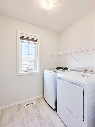 155 Carringham Road Nw, Calgary, AB - Indoor Photo Showing Laundry Room