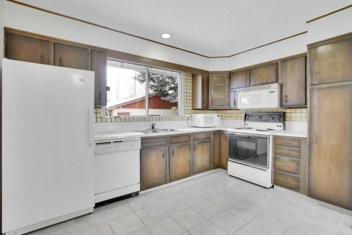 107 Silver Brook Drive Nw, Calgary, AB - Indoor Photo Showing Kitchen With Double Sink