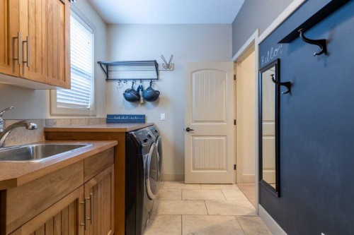 52 Elmont Green Sw, Calgary, AB - Indoor Photo Showing Laundry Room