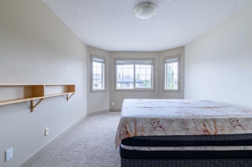 52 Elmont Green Sw, Calgary, AB - Indoor Photo Showing Bedroom