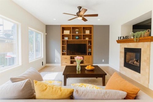 52 Elmont Green Sw, Calgary, AB - Indoor Photo Showing Living Room With Fireplace