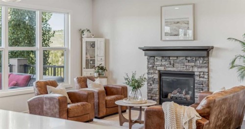 50 Riviera View, Cochrane, AB - Indoor Photo Showing Living Room With Fireplace