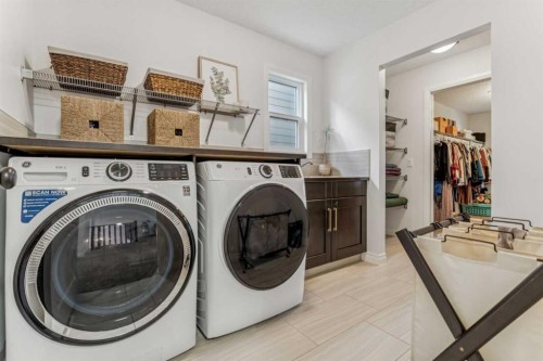 50 Riviera View, Cochrane, AB - Indoor Photo Showing Laundry Room