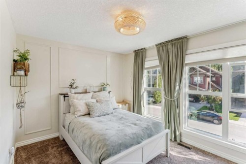 50 Riviera View, Cochrane, AB - Indoor Photo Showing Bedroom