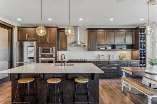 50 Riviera View, Cochrane, AB - Indoor Photo Showing Kitchen With Stainless Steel Kitchen With Upgraded Kitchen