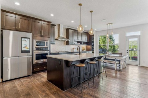 50 Riviera View, Cochrane, AB - Indoor Photo Showing Kitchen With Stainless Steel Kitchen With Upgraded Kitchen