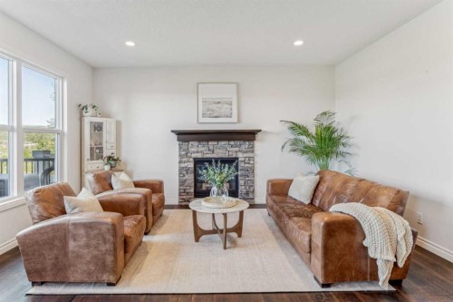 50 Riviera View, Cochrane, AB - Indoor Photo Showing Living Room With Fireplace