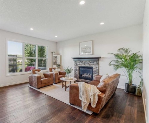 50 Riviera View, Cochrane, AB - Indoor Photo Showing Living Room With Fireplace