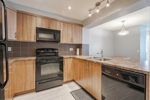 3098 Windsong Boulevard Sw, Airdrie, AB - Indoor Photo Showing Kitchen With Double Sink