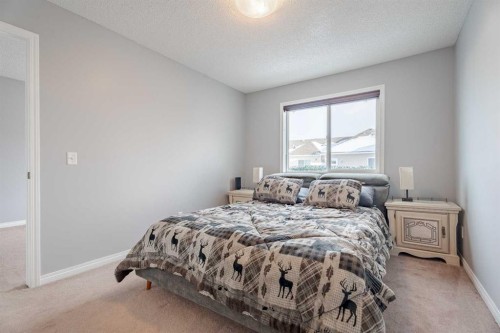 3098 Windsong Boulevard Sw, Airdrie, AB - Indoor Photo Showing Bedroom