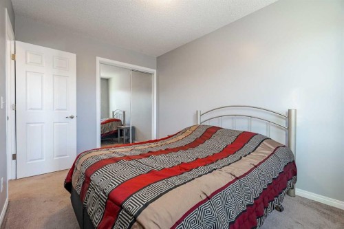 3098 Windsong Boulevard Sw, Airdrie, AB - Indoor Photo Showing Bedroom
