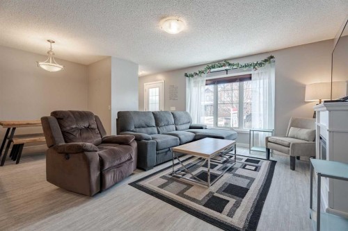 3098 Windsong Boulevard Sw, Airdrie, AB - Indoor Photo Showing Living Room