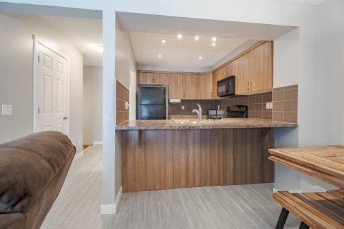 3098 Windsong Boulevard Sw, Airdrie, AB - Indoor Photo Showing Kitchen