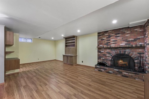 328 Norseman Road Nw, Calgary, AB - Indoor With Fireplace