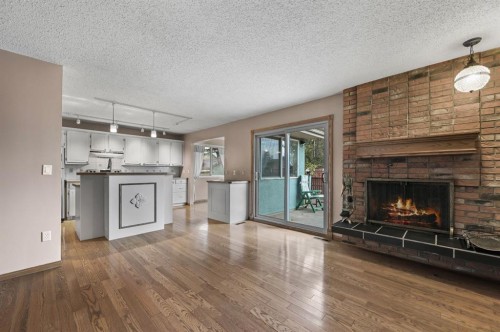 328 Norseman Road Nw, Calgary, AB - Indoor Photo Showing Living Room With Fireplace