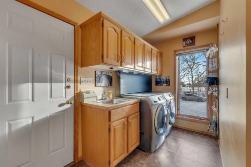 283058 Township Road 245A, Rural Rocky View County, AB - Indoor Photo Showing Laundry Room
