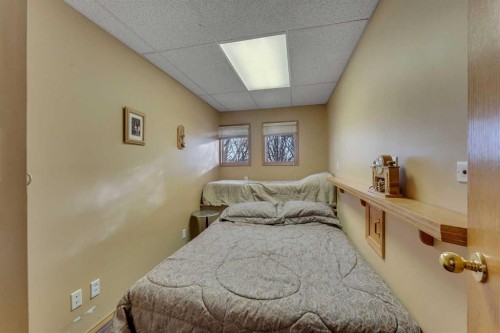 283058 Township Road 245A, Rural Rocky View County, AB - Indoor Photo Showing Bedroom