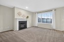 147 Everstone Rise Sw, Calgary, AB  - Indoor Photo Showing Living Room With Fireplace 