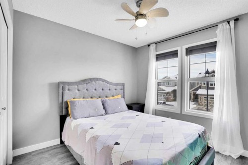 100 Kingsbury Close Se, Airdrie, AB - Indoor Photo Showing Bedroom