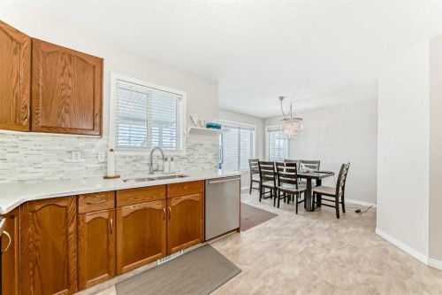 206 Evansmeade Close Nw, Calgary, AB - Indoor Photo Showing Kitchen With Double Sink