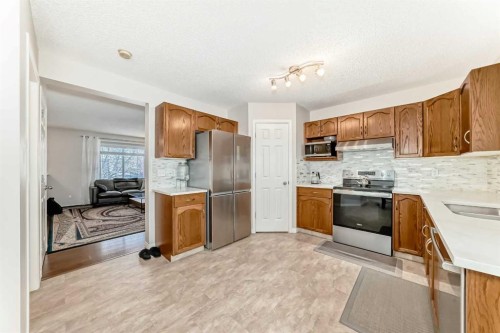 206 Evansmeade Close Nw, Calgary, AB - Indoor Photo Showing Kitchen With Stainless Steel Kitchen With Double Sink