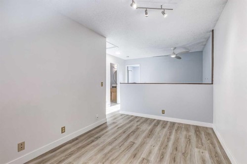 123 Woodsman Lane Sw, Calgary, AB - Indoor Photo Showing Other Room