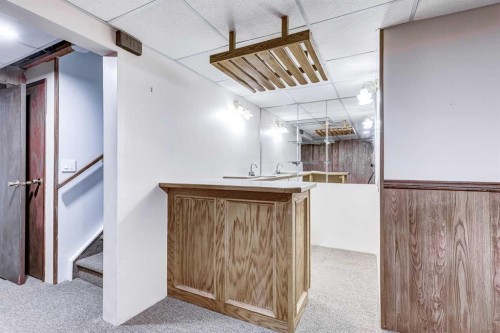 123 Woodsman Lane Sw, Calgary, AB - Indoor Photo Showing Other Room