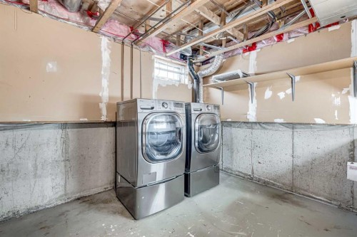 123 Woodsman Lane Sw, Calgary, AB - Indoor Photo Showing Laundry Room
