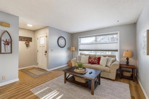 123 Woodsman Lane Sw, Calgary, AB - Indoor Photo Showing Living Room