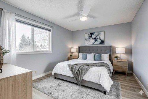 123 Woodsman Lane Sw, Calgary, AB - Indoor Photo Showing Bedroom