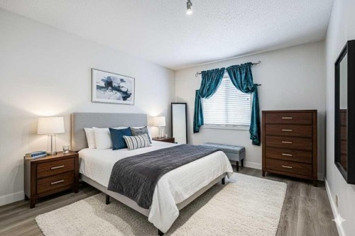 123 Woodsman Lane Sw, Calgary, AB - Indoor Photo Showing Bedroom