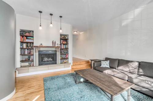 506 19 Avenue Nw, Calgary, AB - Indoor Photo Showing Living Room With Fireplace