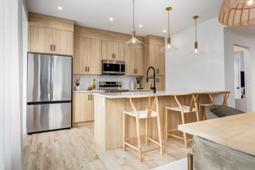 140 Heartwood Lane Se, Calgary, AB - Indoor Photo Showing Kitchen With Stainless Steel Kitchen With Upgraded Kitchen