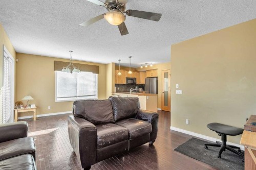 101-2384 Sagewood Gate Sw, Airdrie, AB - Indoor Photo Showing Living Room