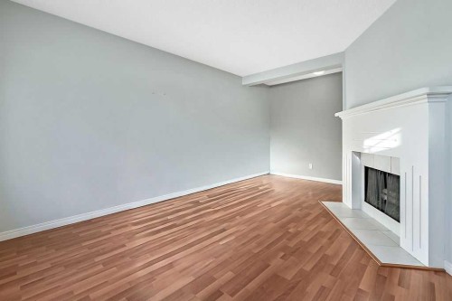 55-740 Bracewood Drive Sw, Calgary, AB - Indoor Photo Showing Other Room With Fireplace