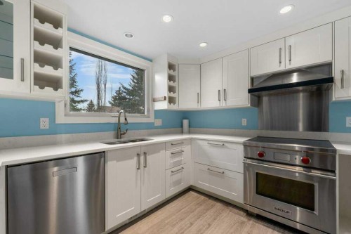 31 Edforth Way Nw, Calgary, AB - Indoor Photo Showing Kitchen With Stainless Steel Kitchen With Double Sink
