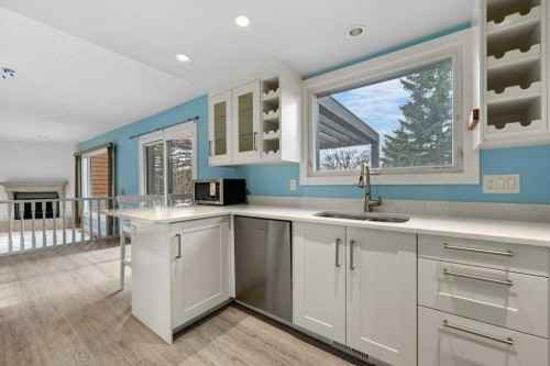 31 Edforth Way Nw, Calgary, AB - Indoor Photo Showing Kitchen With Double Sink